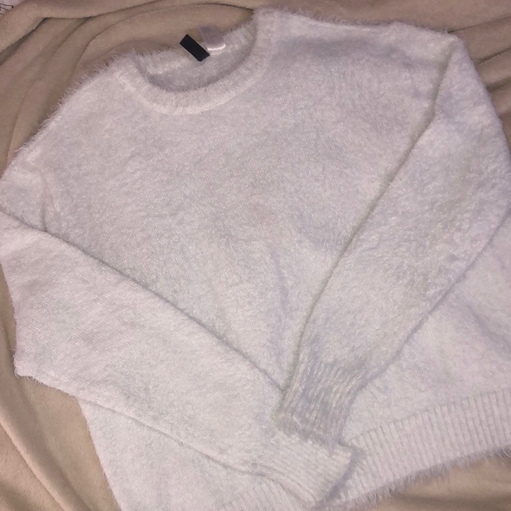 white fuzzy sweater